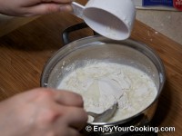 Remove from burner, mix flour in