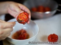 Remove seeds with small spoon and discard