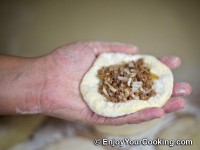 Arrange about table spoon of stuffing in the middle of it