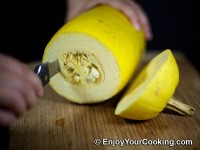 Using long knife slice seed area in a circular motion