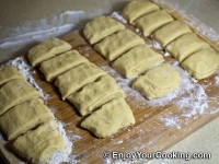 Slice all dough in 4 equal pieces, then slice 2 of them in 5 pieces and 2 of them in 4