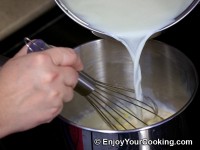 Stir boiled milk in
