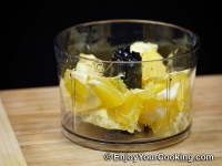 Put orange slices into blender bowl