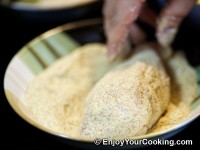 Roll it in bread crumbs, press coating with hands