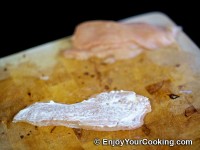 Spread a bit of mayo on top of a chicken slice