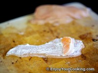 Arrange an orange segment along wider side of the slice