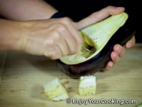 Use spoon to scoop pulp out