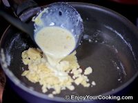 Gradually start mixing sauce spoon by spoon