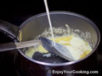 Gradually mix in milk